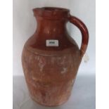 A Bridgwater earthenware pitcher. 14' high. Prov: Estate of Islwyn Watkins