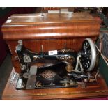 A Gritzner sewing machine in inlaid case