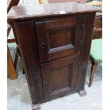 A French joined oak cupboard in gothic style, with fielded sides and enclosed by two fielded panel