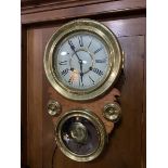 An unusual brass mounted 8 day, chiming wall clock, in maritime 'porthole' design with white