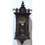 A Vienna style walnut and ebonised wall clock