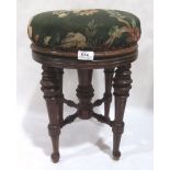 A Victorian walnut piano stool