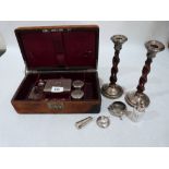 A pair of silver and oak barleytwist candlesticks together with a leather travelling case and