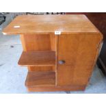 An Art-Deco style walnut island cabinet bookcase