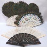 Three peacock feather fans, another with feather leaf and three others