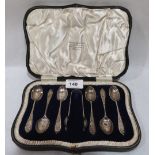 A George V cased set of six silver teaspoons with sugar bow. London 1923