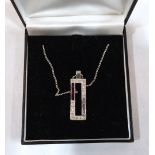 An Art-Deco design gem set pendant