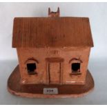 A 19th century glazed earthenware model of a cottage. Dated 1881. Possibly Sussex. 10½' wide.