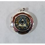 A silver fob pill box with masonic enamel decoration. 1' diam.