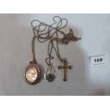 A modernist silver millefiore glass set pendan, a silver gem set crucifix and a silver locket
