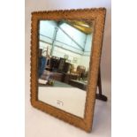 A gilt framed dressing table mirror with strut back. 19' high
