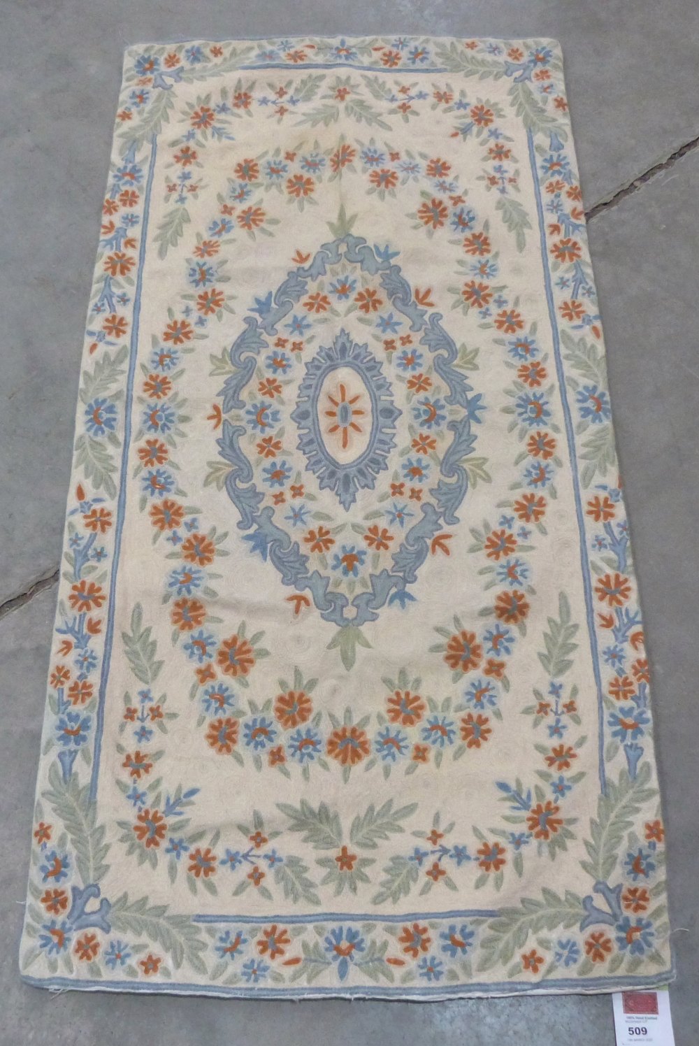 A Kashmiri wool rug. 1.3m x 0.64m