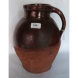 A 19th century salt glazed earthenware pitcher. West Country. 13' high. Prov: Estate of Islwyn