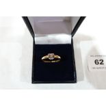 A diamond solitaire ring. In gold marked 750. 3.3g gross. Size P½