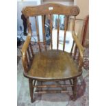 An oak stickback elbow chair