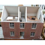A dolls house in the form of a two bay Georgian dwelling. 28' wide