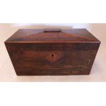 A Regency rosewood and brassline inlaid sarcophagus tea caddy with inset military style handles, the