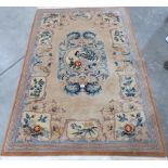 A Chinese beige ground rug. 75' x 47'