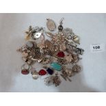 A collection of silver charms and other jewellery