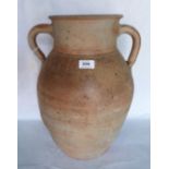 A French terracotta unglazed two handled jar. 18' high. Prov: Estate of Islwyn Watkins