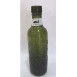 A green Coventry Mineral Water Company bottle. 9' high
