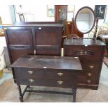 An oak wardrobe, tallboy, dressing table and dressing mirror