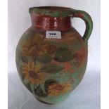 A 19th century Donyatt earthenware pitcher with painted decoration. 12½' high. Prov: Estate of