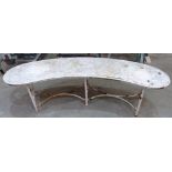 A vintage iron garden seat of curved form. 63' long