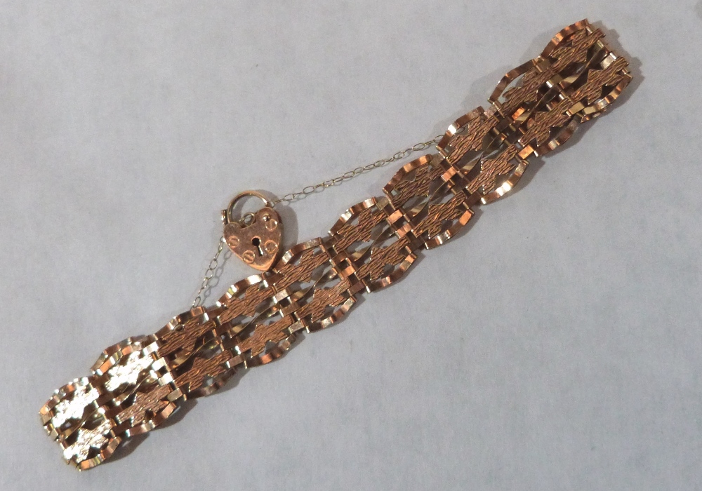 A 9ct fancy link bracelet with padlock clasp. 6.8g