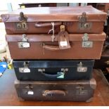 A vintage leather case and three others