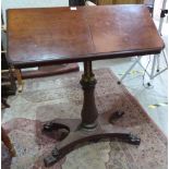 An early Victorian mahogany reading table, the rising top with two ratchet bookrests, on baluster