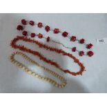 Two coral necklaces and a necklace of graduated bone beads