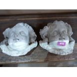 A pair of cherubic mask garden wall plaques. 8' high