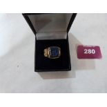 An Islamic gilt metal blue stone intaglio ring. Size K½'