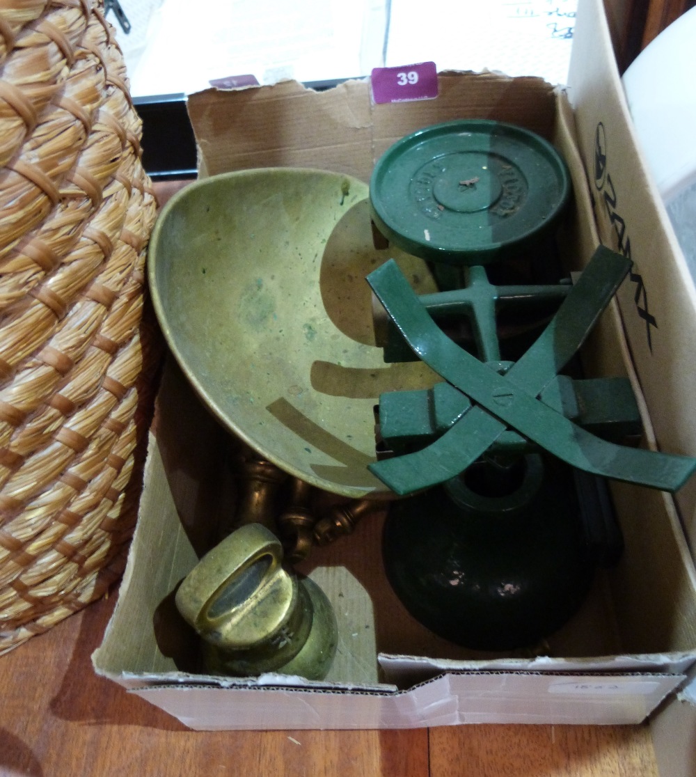 A set of weighing scales with brass weights