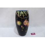 A Crown Ducal ovoid vase decorated with Chinese lanterns and bamboo on a buff black ground. 8' high