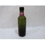 A green Coventry Mineral Water Company bottle. 9' high