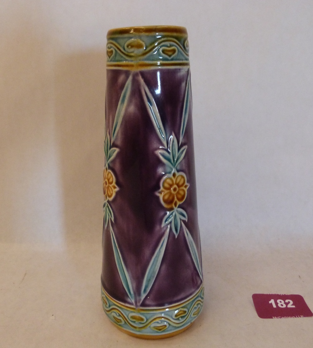 A Minton Secessionist form tapered vase, tube-line decorated with stylised foliage on a purple