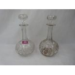 A pair of cut glass decanters. 11' high