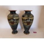 A pair of Royal Doulton inverted baluster vases, brush line decorated with tubs of roses on a