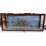 A cased scratch-built model of a battleship. 21' x 53'