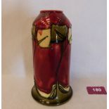 A Minton Secessionist cylindrical vase, number 46, tube-line decorated with stylised foliage on a