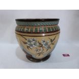 A Doulton Lambeth jardiniere, decorated by Eliza Simmance with flowering prunus in reserves. Signed,