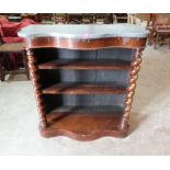 A Victorian rosewood serpentine pier open bookcase with marble top. 36' wide