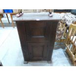 A French joined oak cupboard in gothic style, with fielded sides and enclosed by two fielded panel