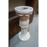 A composite stone garden pedestal. 28' high