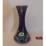 A Minton Secessionist tapered vase, number 33, tube-line decorated with flowers on a purple