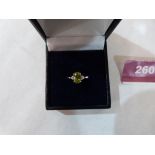 An 18ct yellow sapphire and diamond three stone ring. 2.8g gross. Size N½