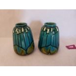 A pair of Minton Secessionist vases, number 4, tube-line decorated in shades of blue and green