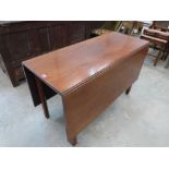 A 19th century mahogany dropleaf table. 46' wide